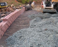 Stone Placement at the Calmos Street Stream Bank Slope Stabilization